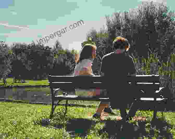 A Person Sitting On A Bench In A Park, Observing The City Around Them. The Invisible City: Travel Attention And Performance