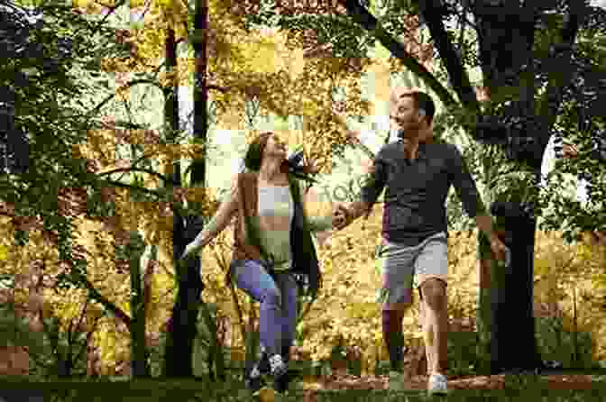 Couple Holding Hands, Laughing And Embracing In A Park, Surrounded By Nature How To Have Meaningful Relationships (Survive The Modern World)